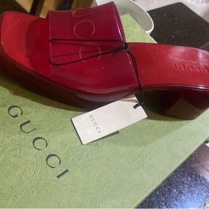 GUCCI Iconic open toe embossed logo mules. 100% authentic. Brand New. Size 7.